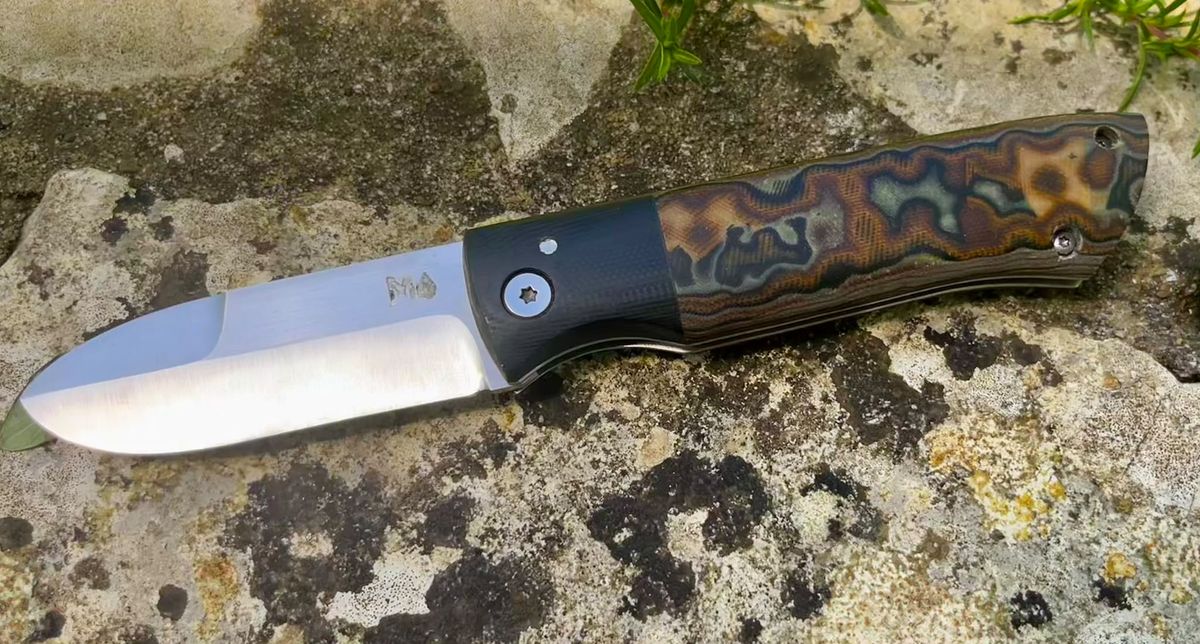 Bonsmara friction folder with camo damacarta scales open