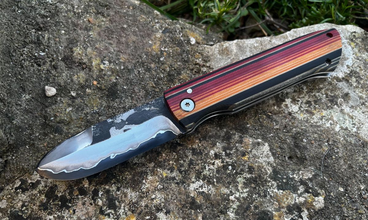 Bonsmara friction folder in san mai with Mexican blanket micarta