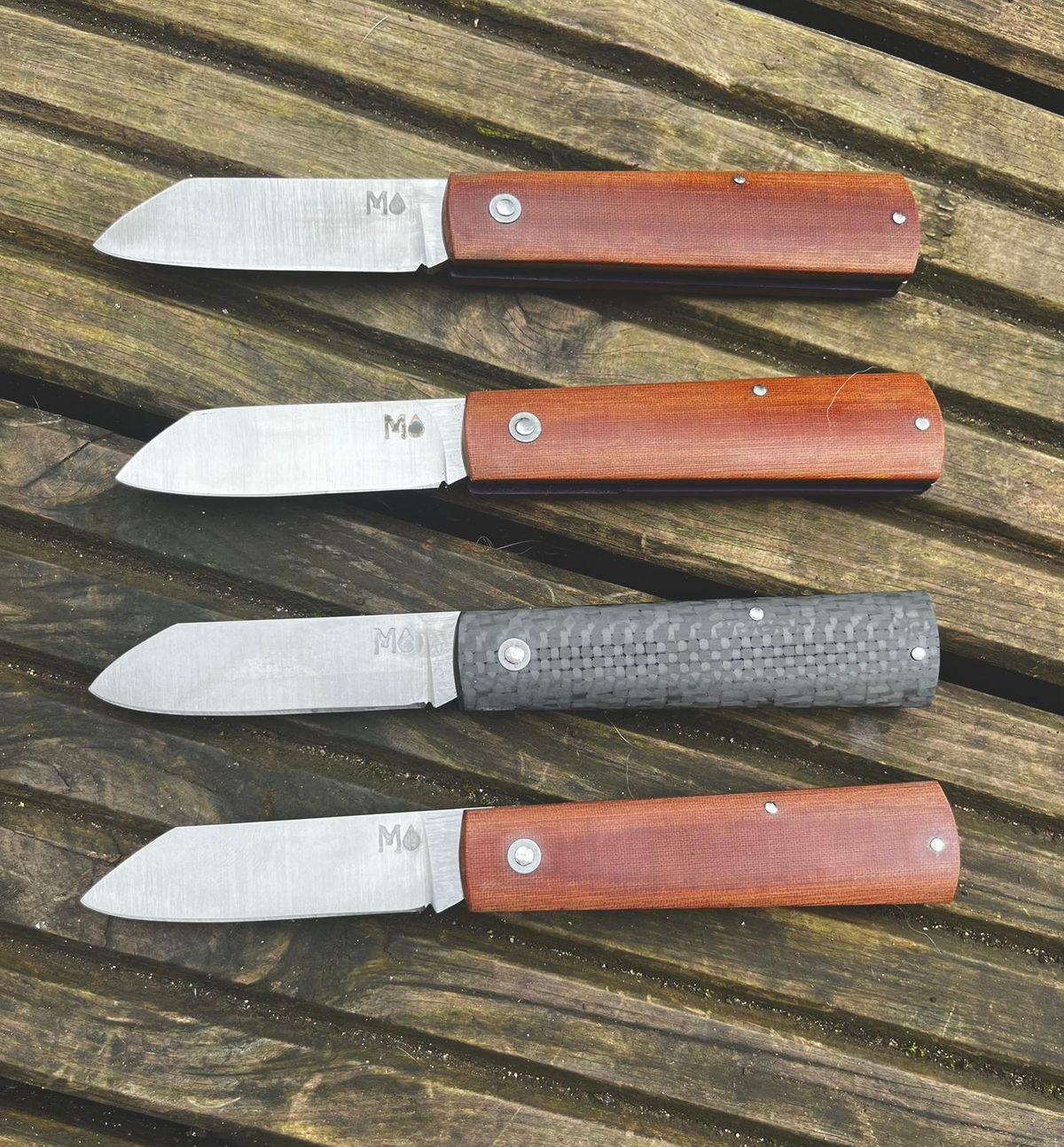 Four ultralight slipjoints with O1 blades open